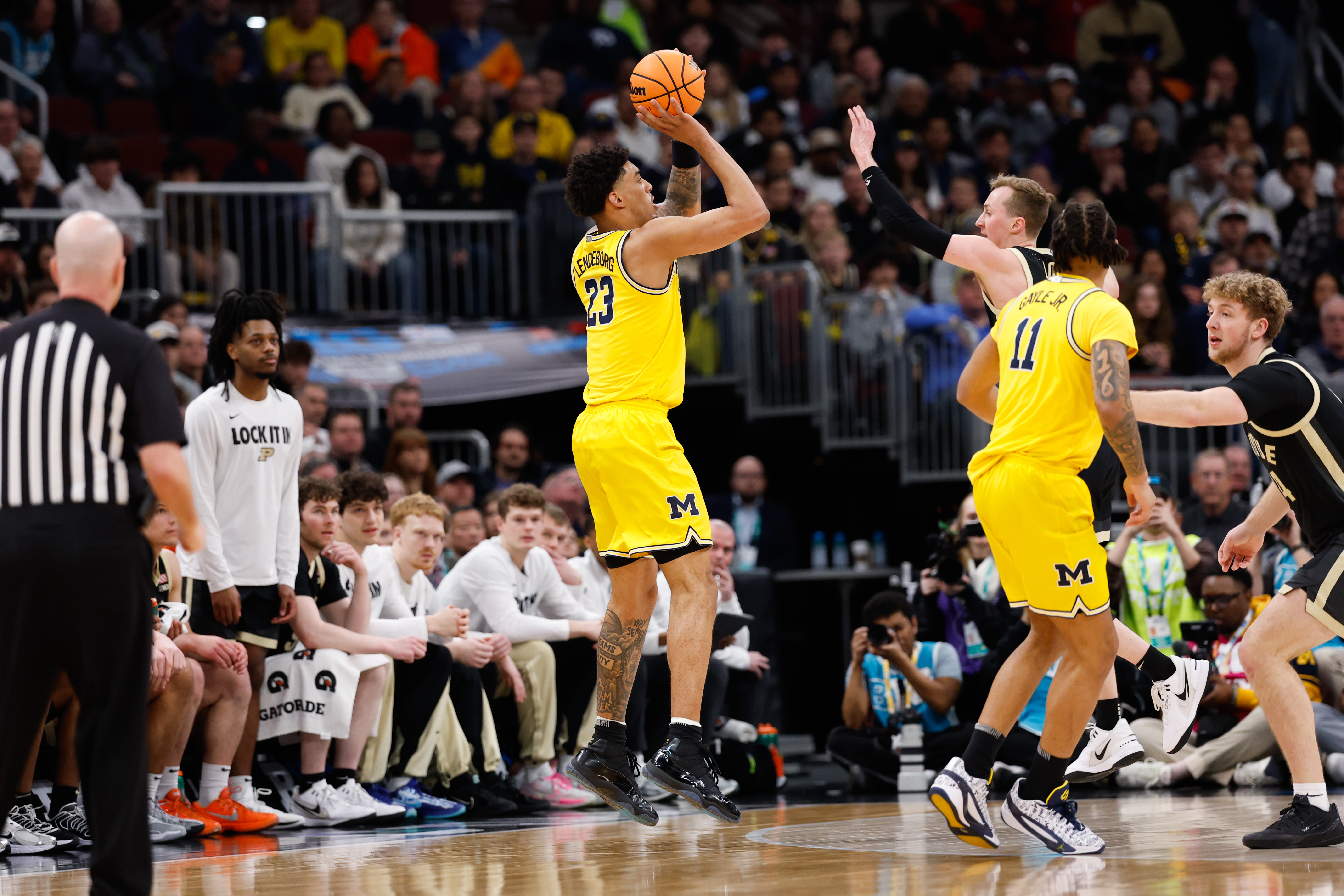 Michigan Wolverines forward Yaxel Lendeborg takes a 3-point shot as we make our best Howard vs. Michigan prediction.