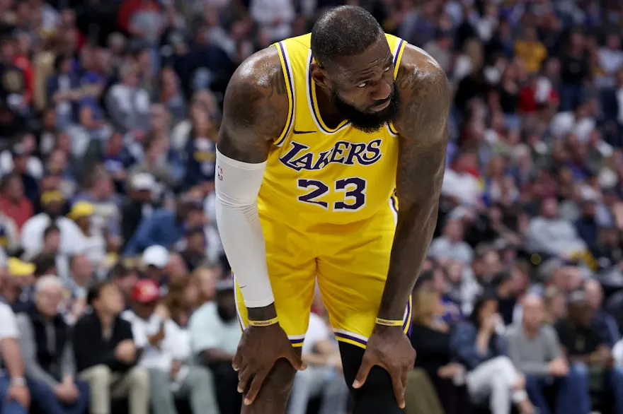 LeBron James of the Los Angeles Lakers gathers himself after taking a hard hit while playing the Denver Nuggets in the Western Conference playoffs. The Lakers are the favorite by the LeBron James Next Team Odds. 