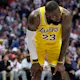 LeBron James of the Los Angeles Lakers gathers himself after taking a hard hit while playing the Denver Nuggets in the Western Conference playoffs. The Lakers are the favorite by the LeBron James Next Team Odds. 