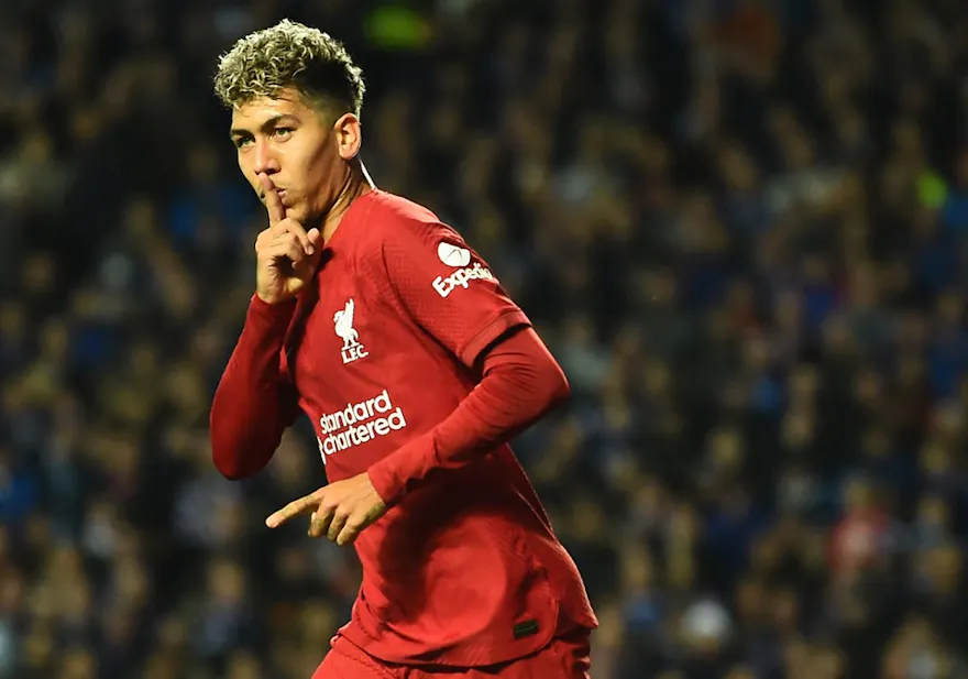 Liverpool's Brazilian striker Roberto Firmino celebrates scoring his team's first goal during the UEFA Champions League Group A football match between Glasgow Rangers and Liverpool at the Ibrox Stadium, in Glasgow, on October 12, 2022.