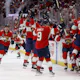 Carter Verhaeghe of the Florida Panthers is congratulated by his teammates after scoring the game-winning goal against the Vegas Golden Knights in Game 3 of the 2023 NHL Stanley Cup Final.