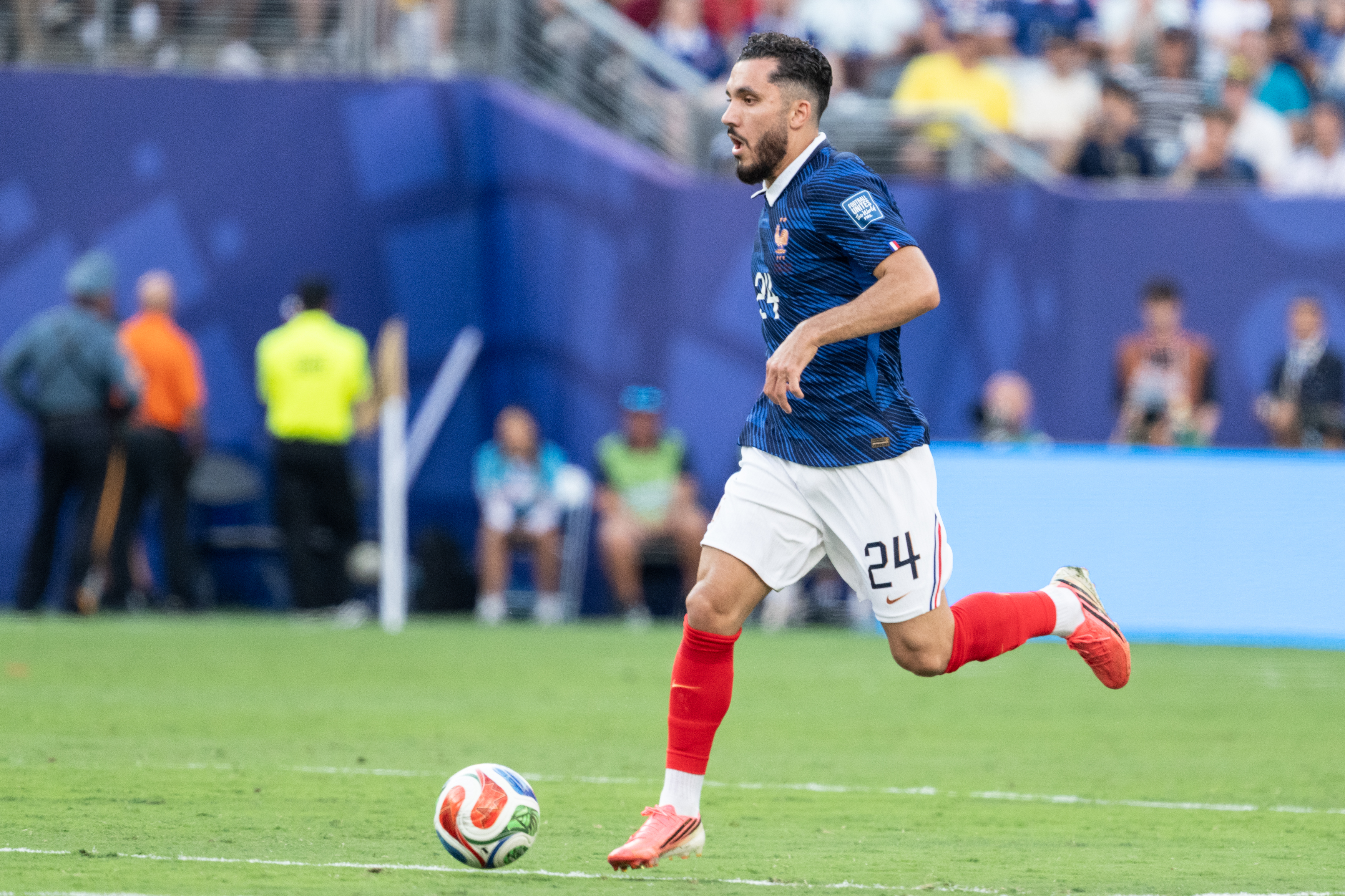 Midfielder Rayan Cherki of France controls the ball as we make our best France vs. England prediction