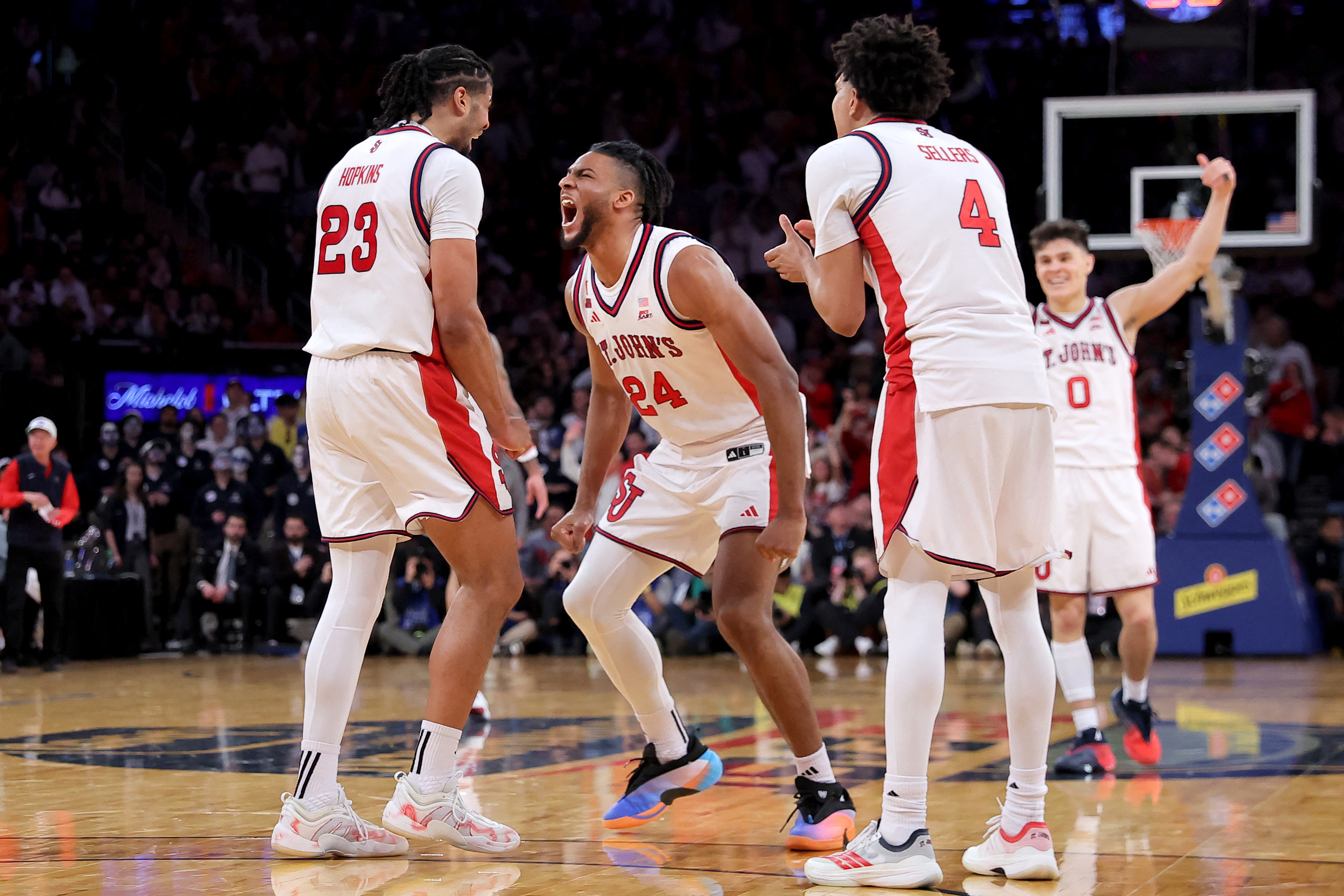 St. John's Red Storm forward Zuby Ejiofor (24), featured in our Northern Iowa vs. St. John's prediction, celebrates with teammates during the Big East Tournament Championship.