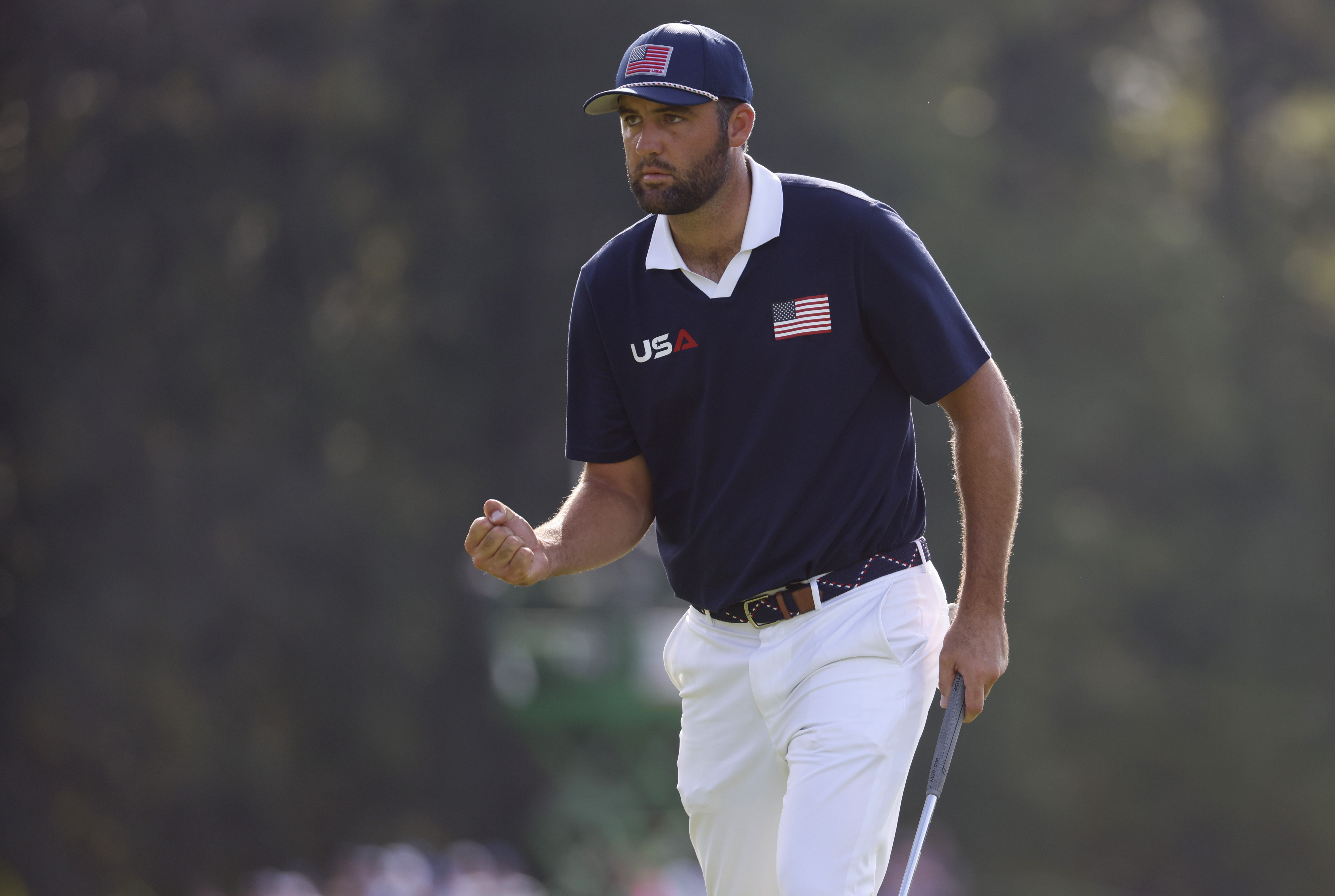 Scottie Scheffler celebrates after making a putt as we look at the 2026 Masters Odds, with our best prediction