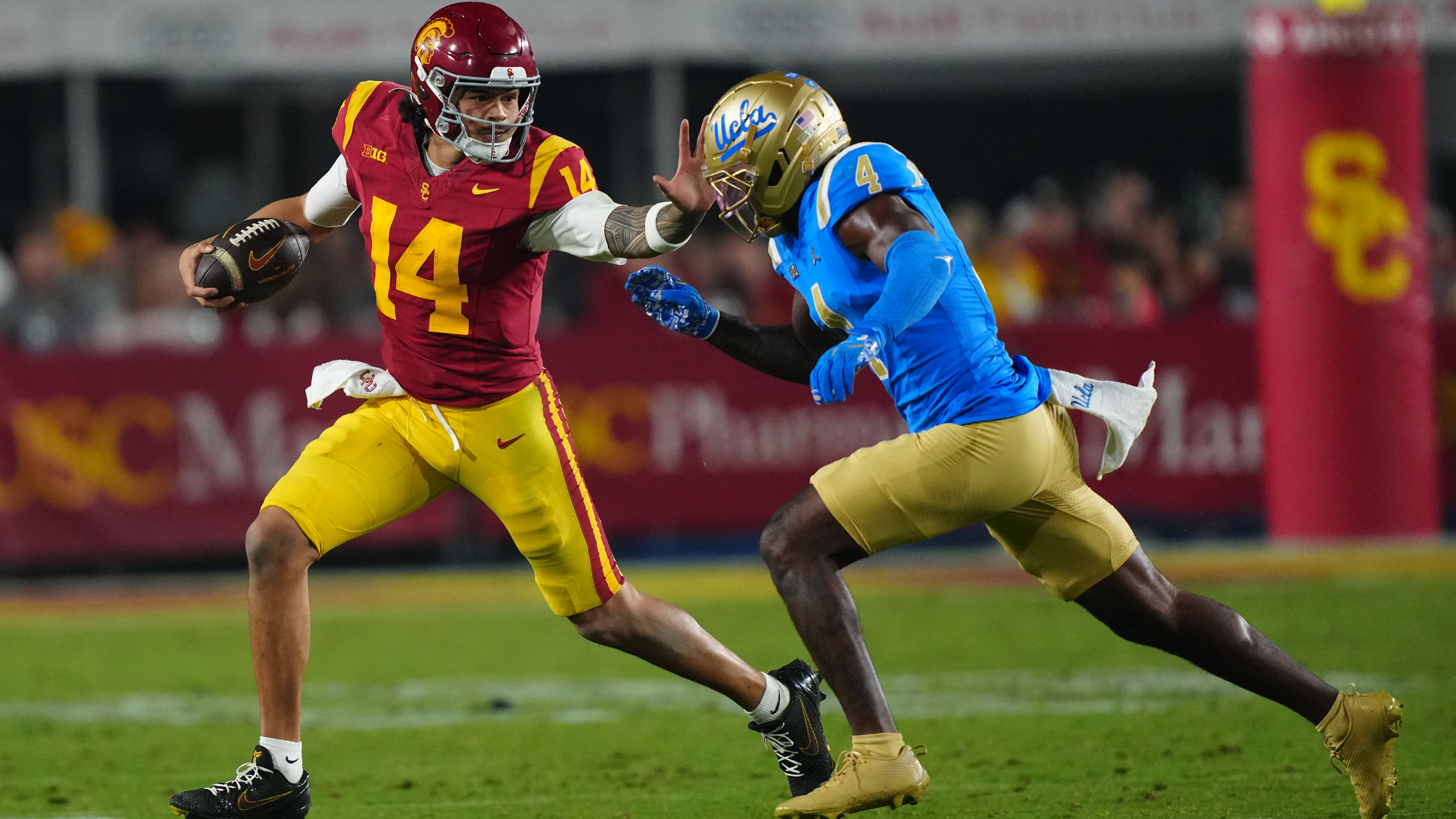 USC quarterback Jayden Maiava (14) carries the ball as we break down our San Jose State vs. USC predictions.