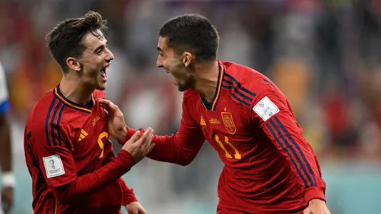 Spain's forward #11 Ferran Torres celebrates with Spain's midfielder #09 Gavi after scoring his team's fourth goal during the Qatar 2022 World Cup Group E football match between Spain and Costa Rica at the Al-Thumama Stadium in Doha on Nov. 23. 