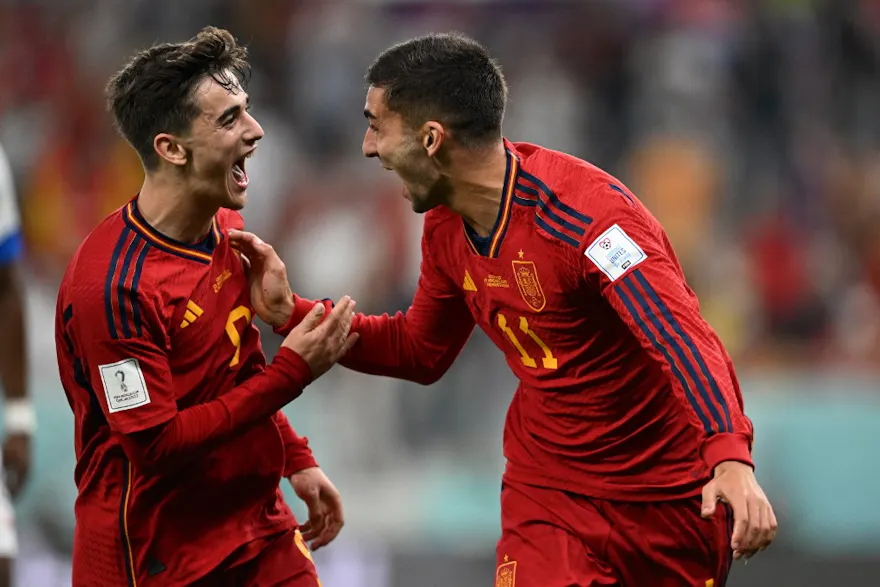 Spain's forward #11 Ferran Torres celebrates with Spain's midfielder #09 Gavi after scoring his team's fourth goal during the Qatar 2022 World Cup Group E football match between Spain and Costa Rica at the Al-Thumama Stadium in Doha on Nov. 23. 