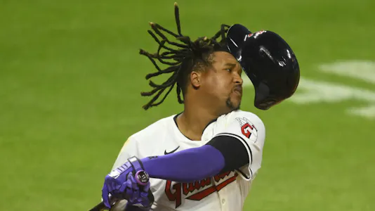 Cleveland Guardians third baseman Jose Ramirez loses his helmet on a swing as we look at our best Guardians vs. Yankees prediction.