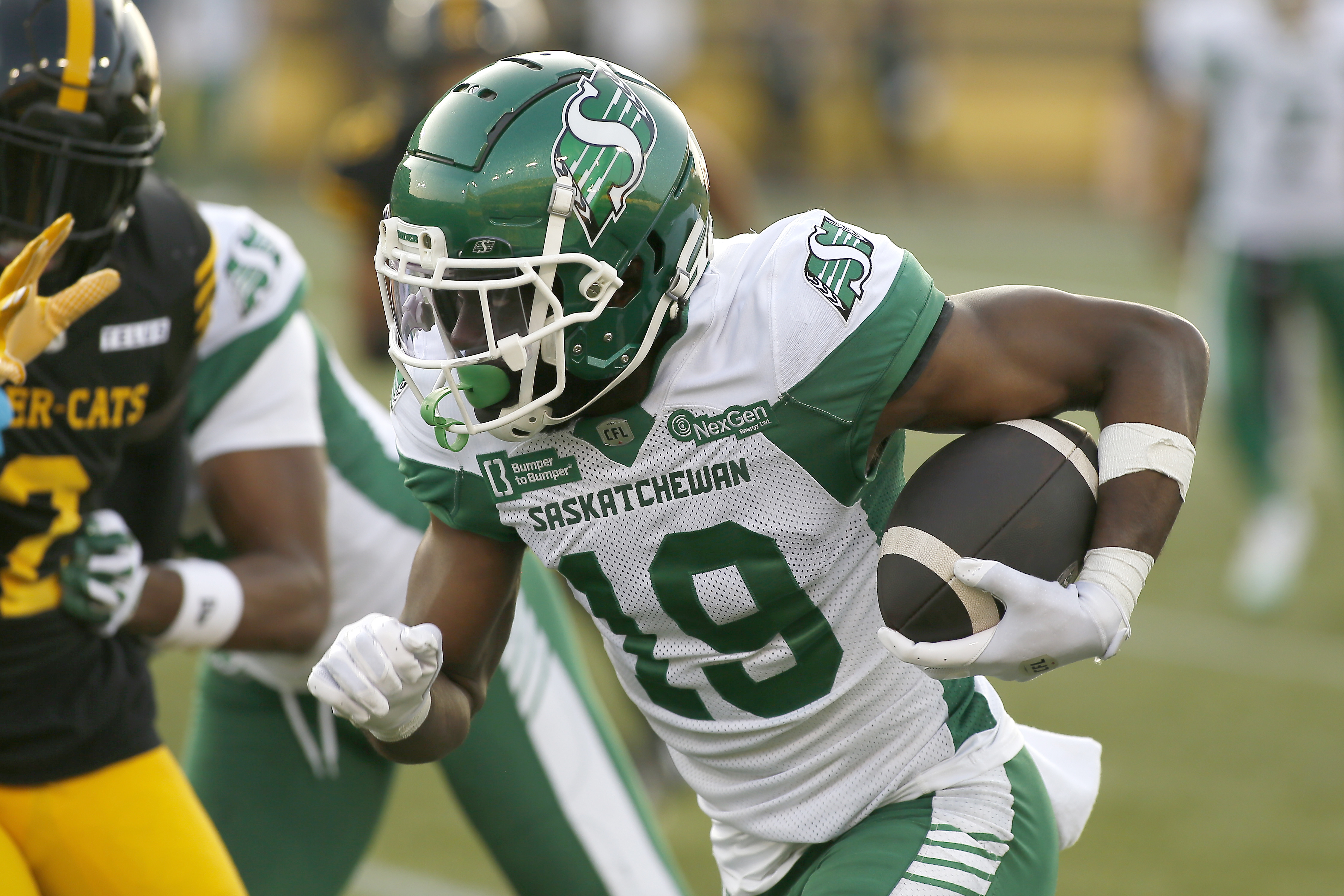 Saskatchewan Roughriders wide receiver Samuel Emilus (19) - who is featured in our Alouettes vs. Roughriders same-game parlay for the CFL's 112th Grey Cup - runs with the football.