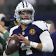 Dak Prescott of the Dallas Cowboys warms up prior to the game against the Washington Commanders as we look at our BetMGM promo code for Seahawks-Cowboys.