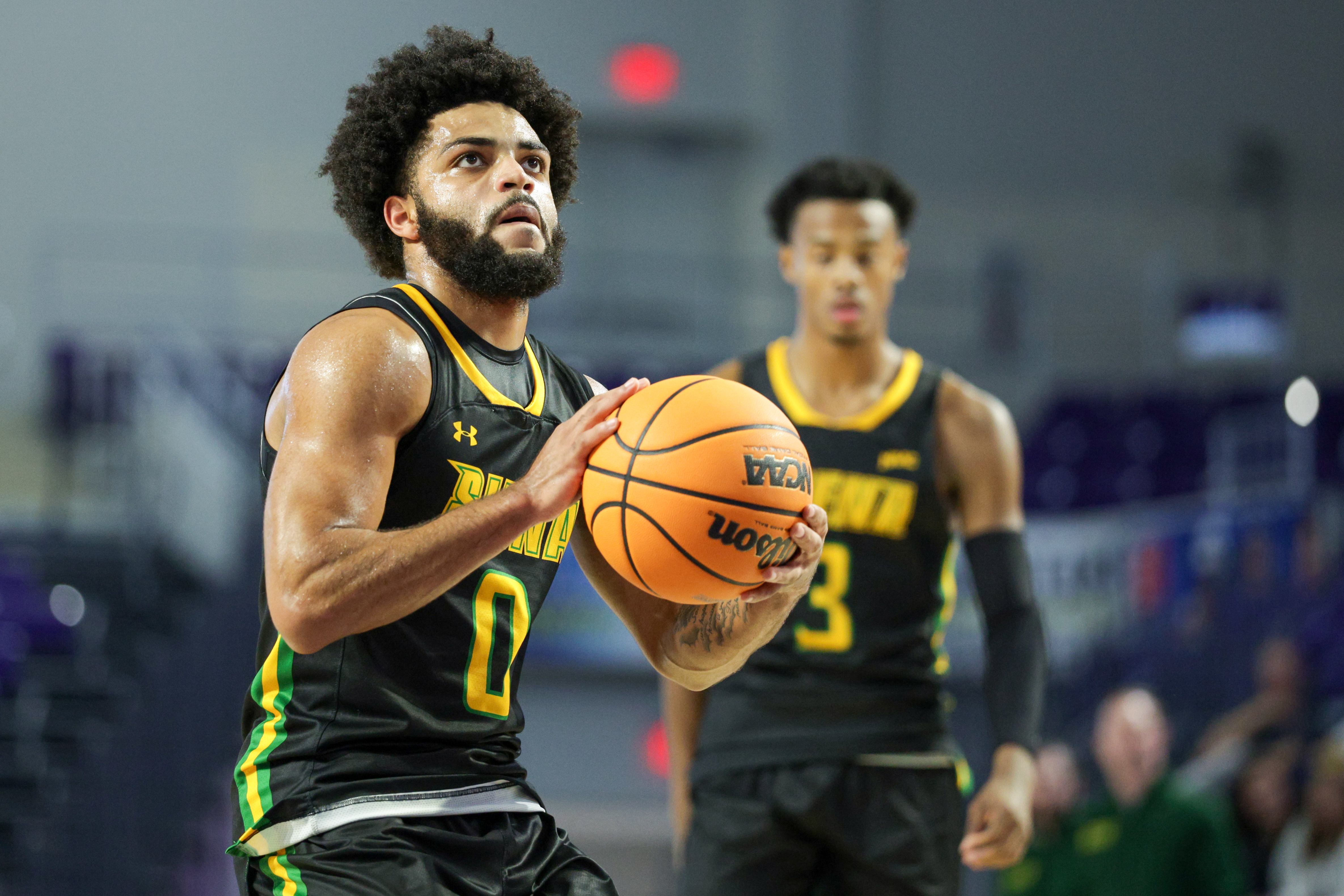 Siena Saints guard Justice Shoats (0) attempts a free throw as he is featured in our Siena vs. Merrimack prediction.