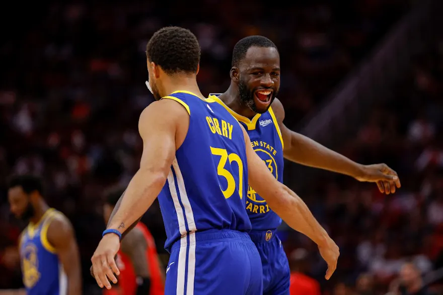 Draymond Green #23 of the Golden State Warriors and Stephen Curry #30 celebrate in the first half as we look at our Clippers vs. Warriors NBA player prop predictions