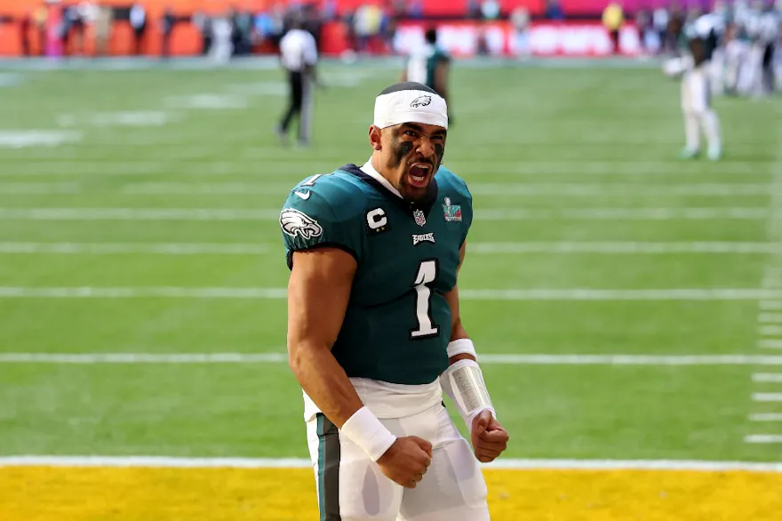 Jalen Hurts of the Philadelphia Eagles reacts before playing against the Kansas City Chiefs in Super Bowl LVII, and we look at the NFL win total odds.