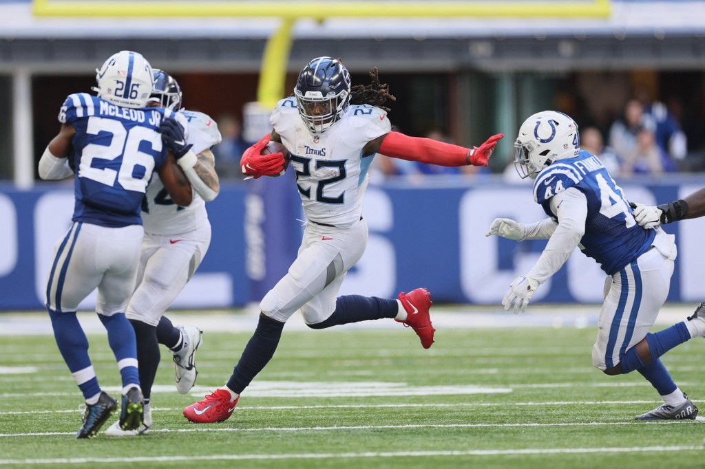 Derrick Henry of the Tennessee Titans runs past Zaire Franklin of the Indianapolis Colts at Lucas Oil Stadium on October 02, 2022 in Indianapolis, Indiana. Andy Lyons/Getty Images via AFP.