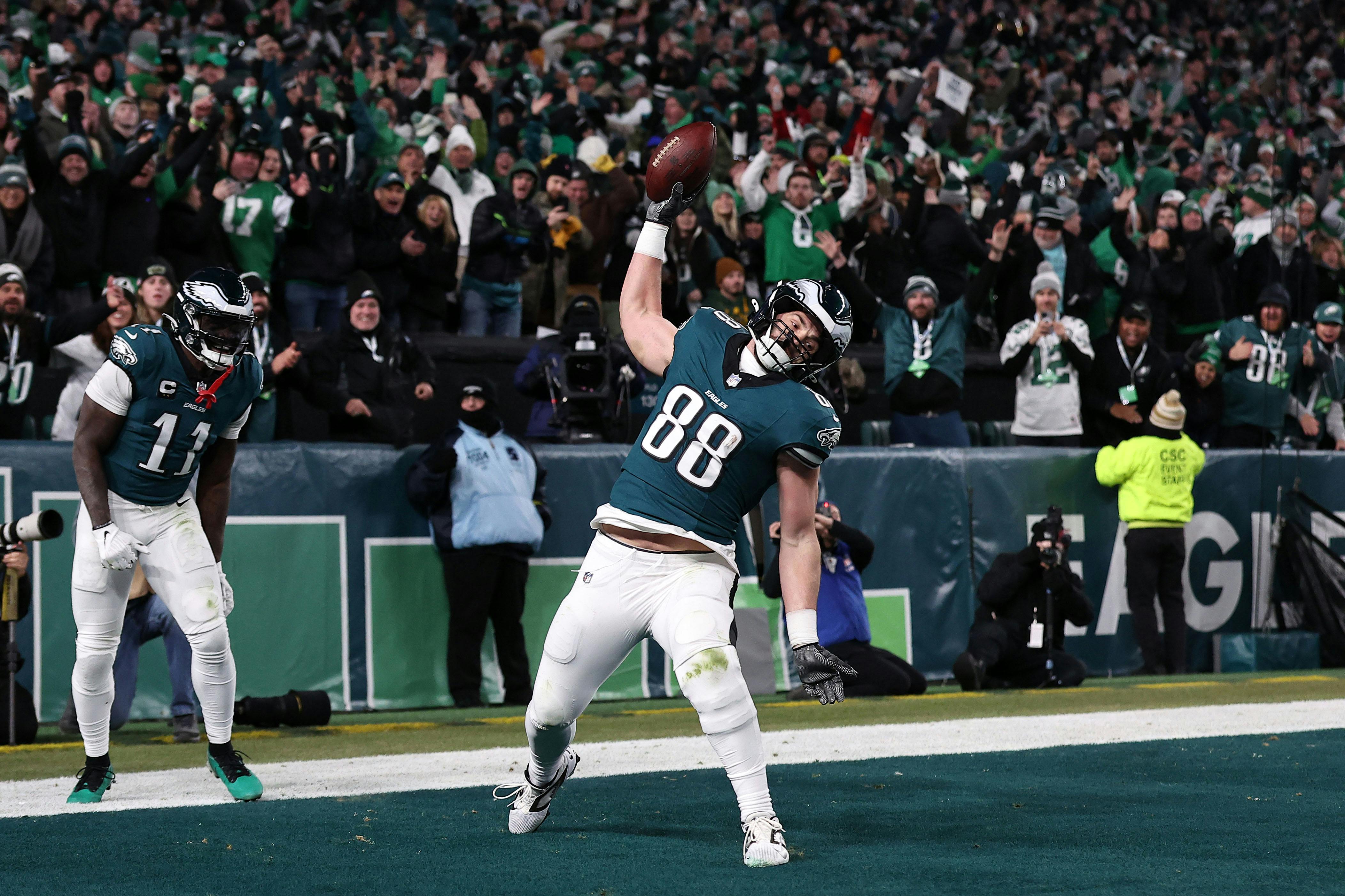 Philadelphia Eagles tight end Dallas Goedert reacts after scoring a touchdown as look at our divisional round expert picks.