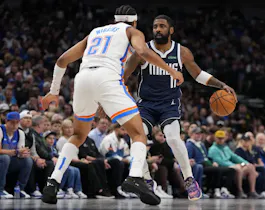 Kyrie Irving (11) of the Dallas Mavericks is defended by Aaron Wiggins (21) of the Oklahoma City Thunder, as we offer our best Mavericks vs. Thunder player props for Game 1 on Tuesday at Paycom Center in Oklahoma City.