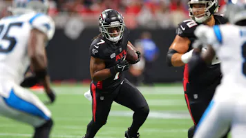 Bijan Robinson of the Atlanta Falcons runs the ball during the first quarter against the Carolina Panthers as we look at our Falcons-Jaguars prop picks.