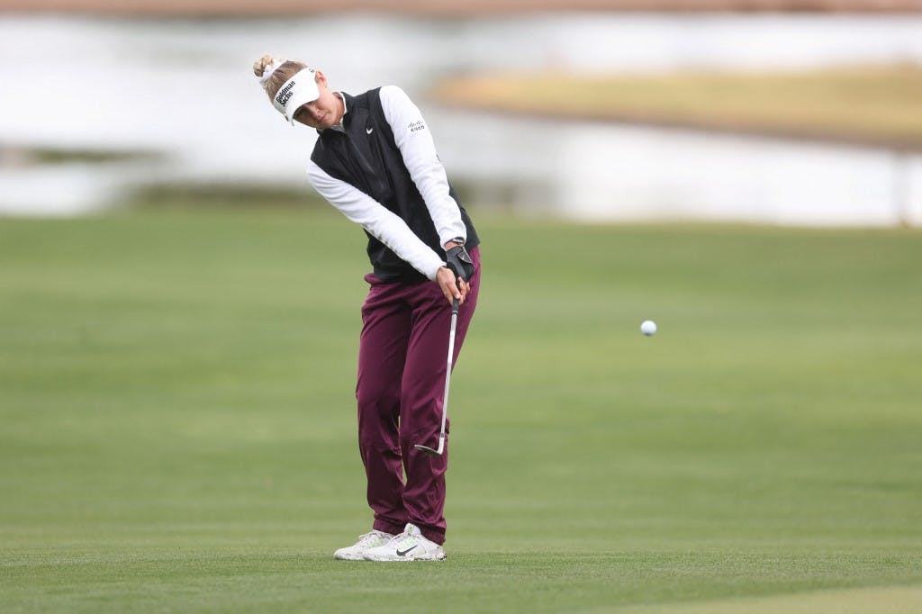 Nelly Korda of the United States chips on the 18th green during the final round of the Ford Championship presented by KCC at Seville Golf and Country Club on March 31, 2024 in Phoenix, Arizona. Photo by Christian Petersen/Getty Images via AFP.