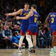 Nikola Jokic and Christian Braun of the Denver Nuggets talk during a timeout as we look at the best NBA MVP odds.