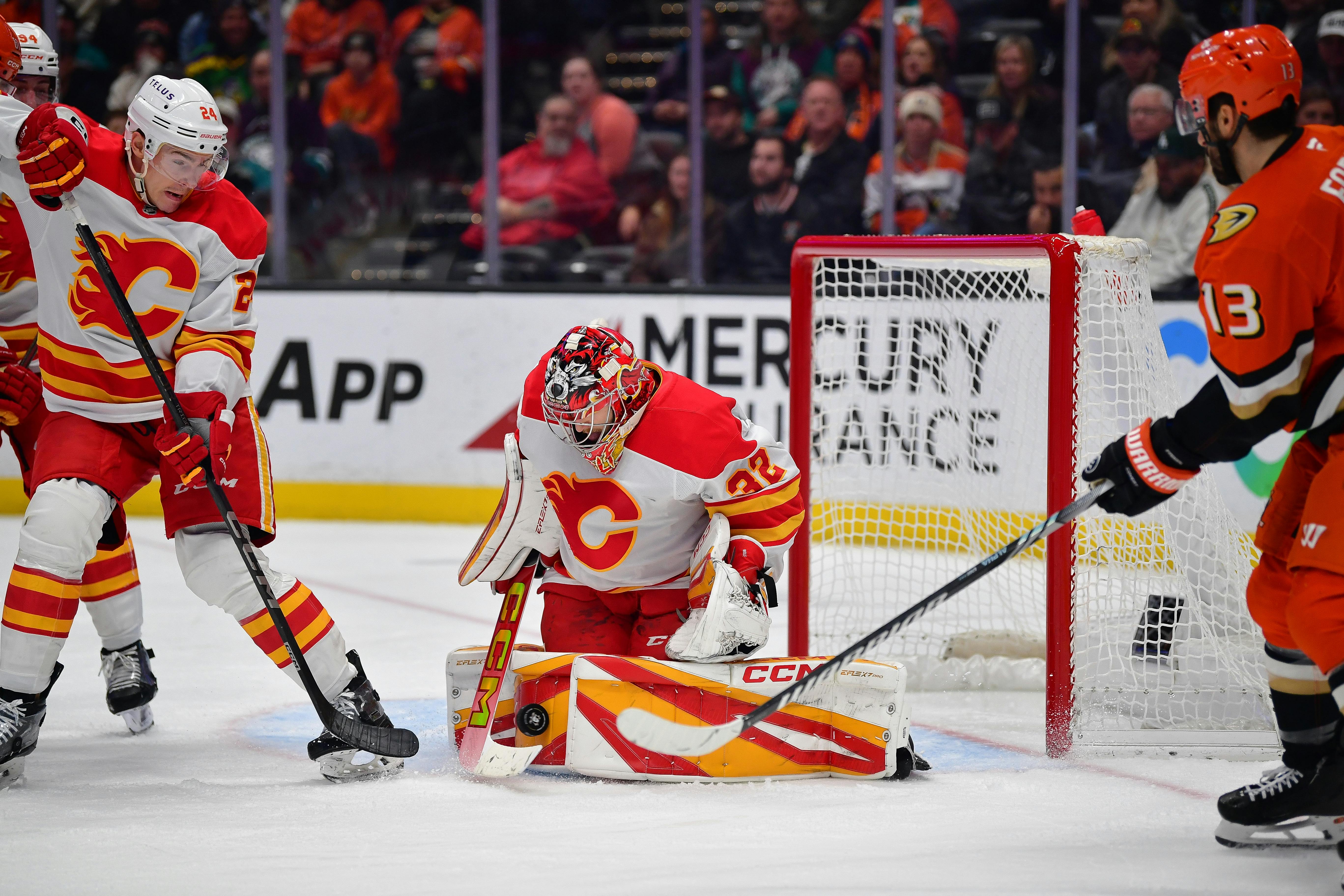 Calgary Flames goaltender Dustin Wolf blocks a shot against the Anaheim Ducks center as we break down the 2025 Calder Trophy odds. 