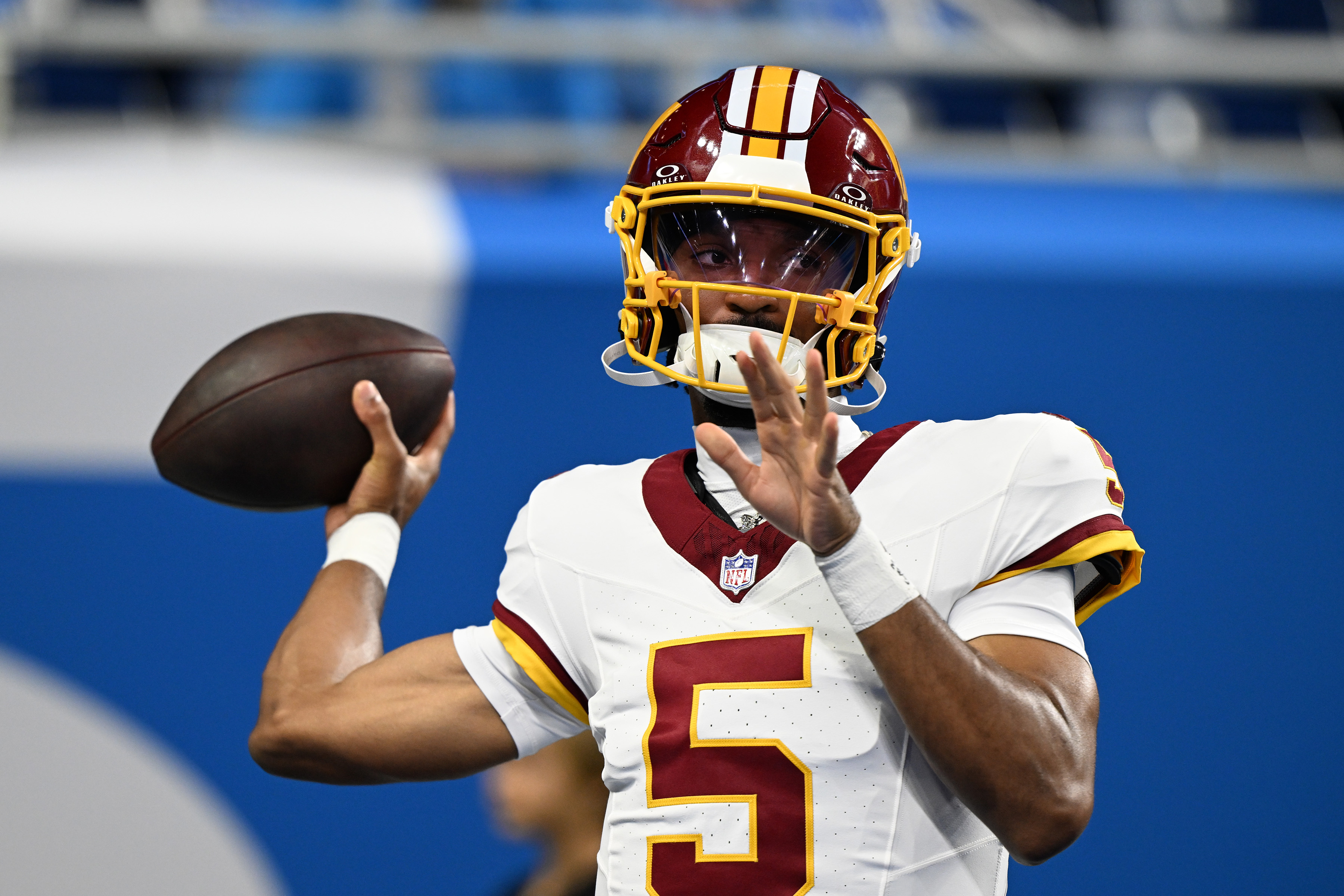 Washington Commanders quarterback Jayden Daniels (5) throws passes as we break down our Commanders vs. 49ers prediction.