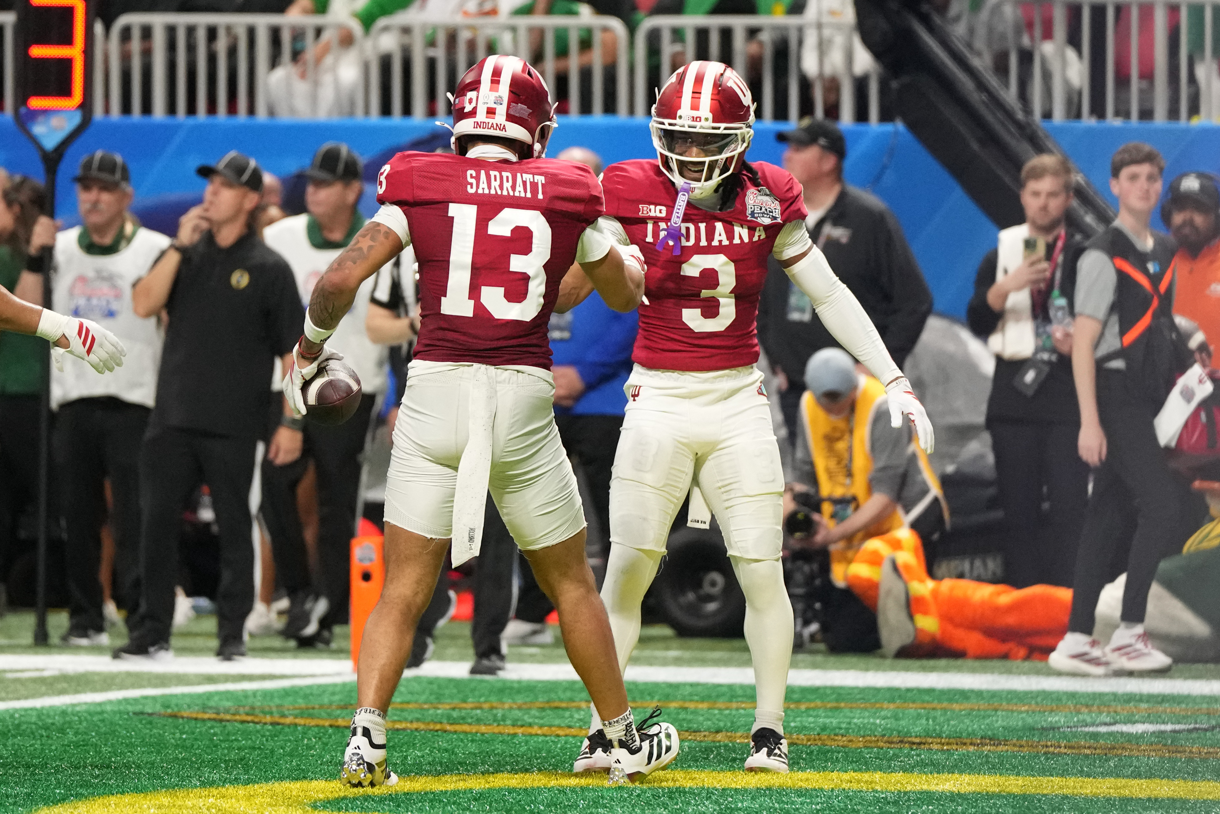 Indiana wide receivers Elijah Sarratt (13) and Omar Cooper Jr. (3) celebrate as we look at the top betting markets for the 2026 CFP National Championship between Indiana and Miami. 