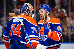 Edmonton Oilers goaltender Stuart Skinner and center Connor McDavid celebrate as we look at the best 2024 Conn Smythe Trophy odds.