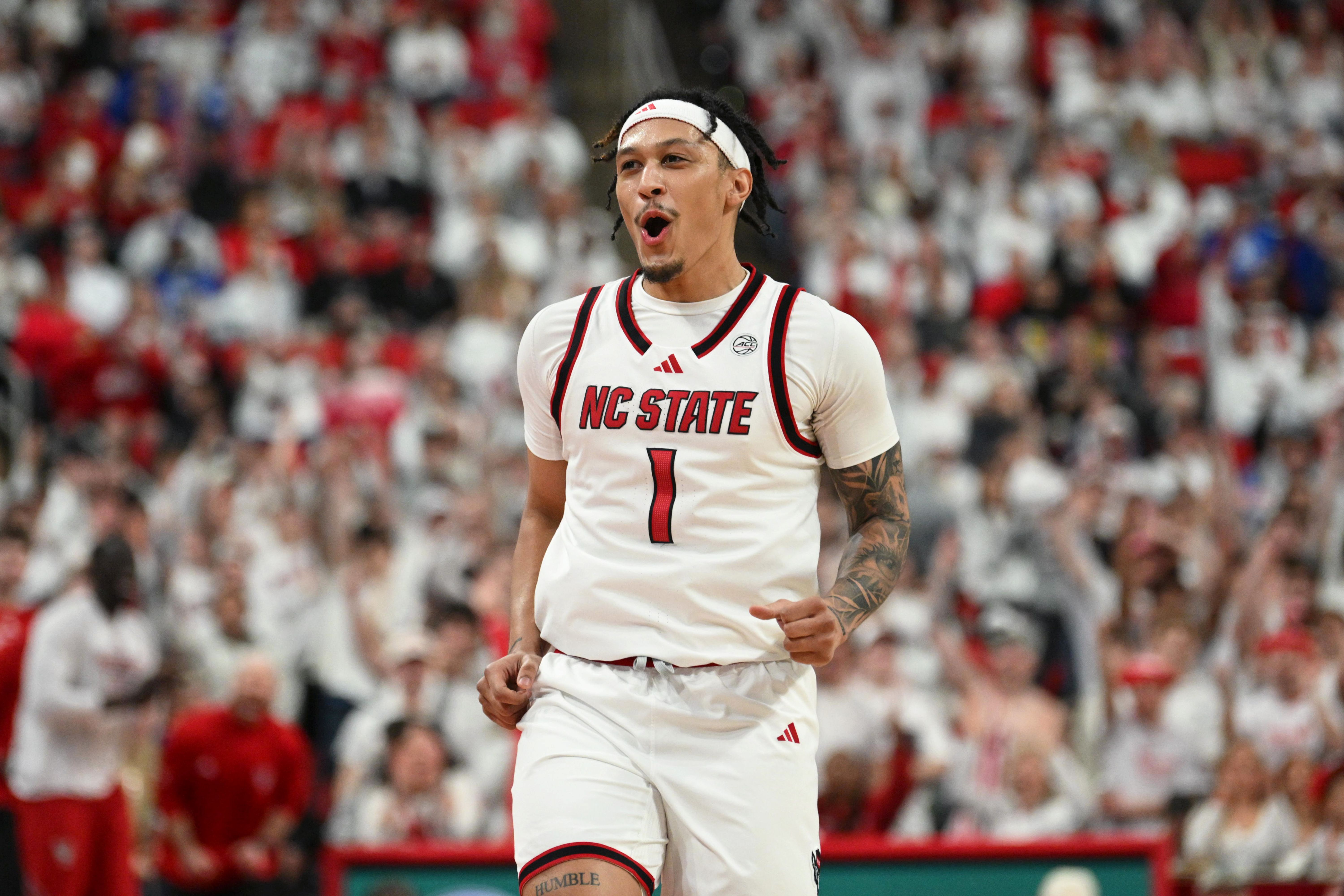 NC State Wolfpack forward Darrion Williams reacts after scoring, as he's featured as we look at our Texas vs. NC State predictions.