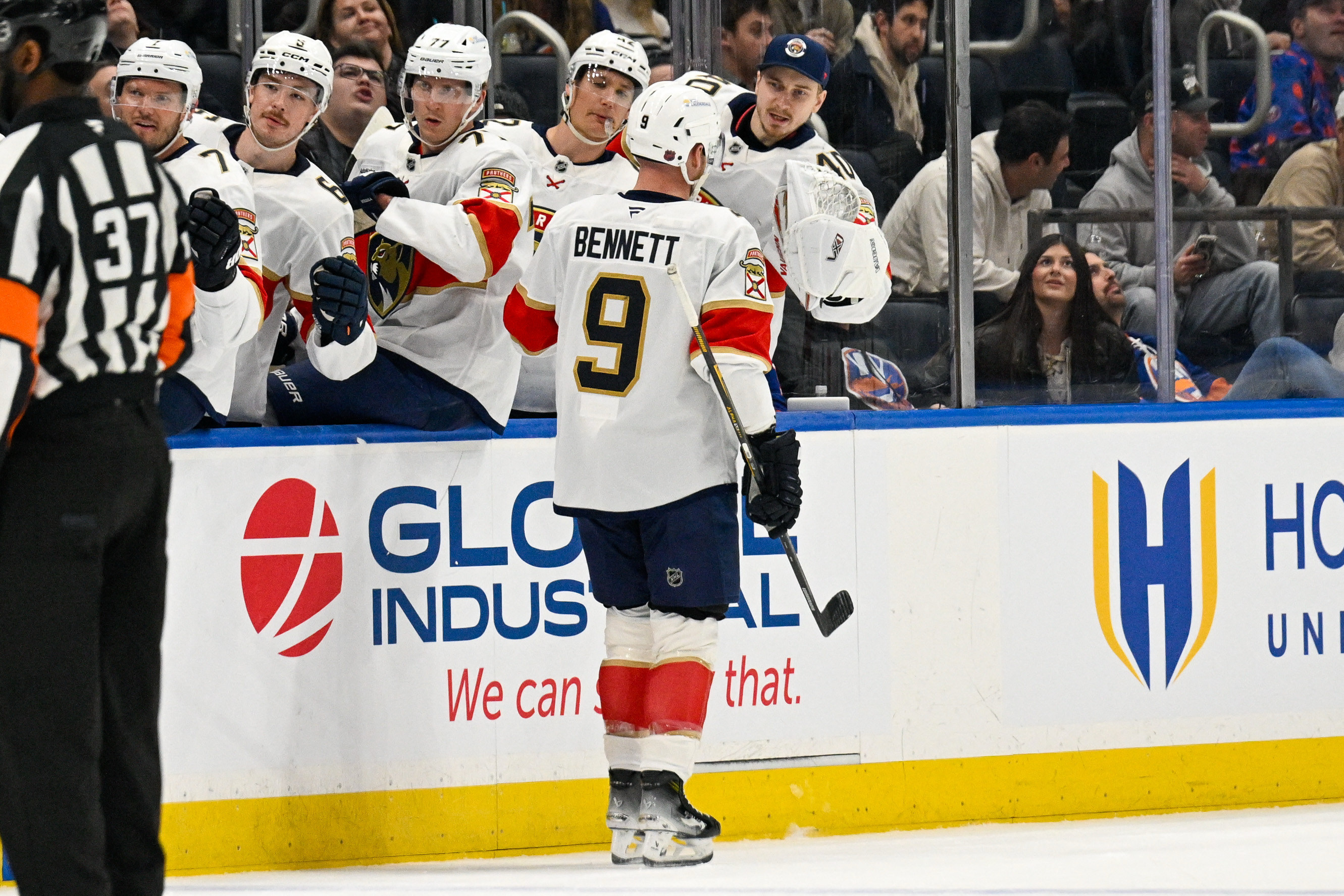 Sam Bennett celebrates a goal with teammates as we provide our Panthers vs. Devils prediction.