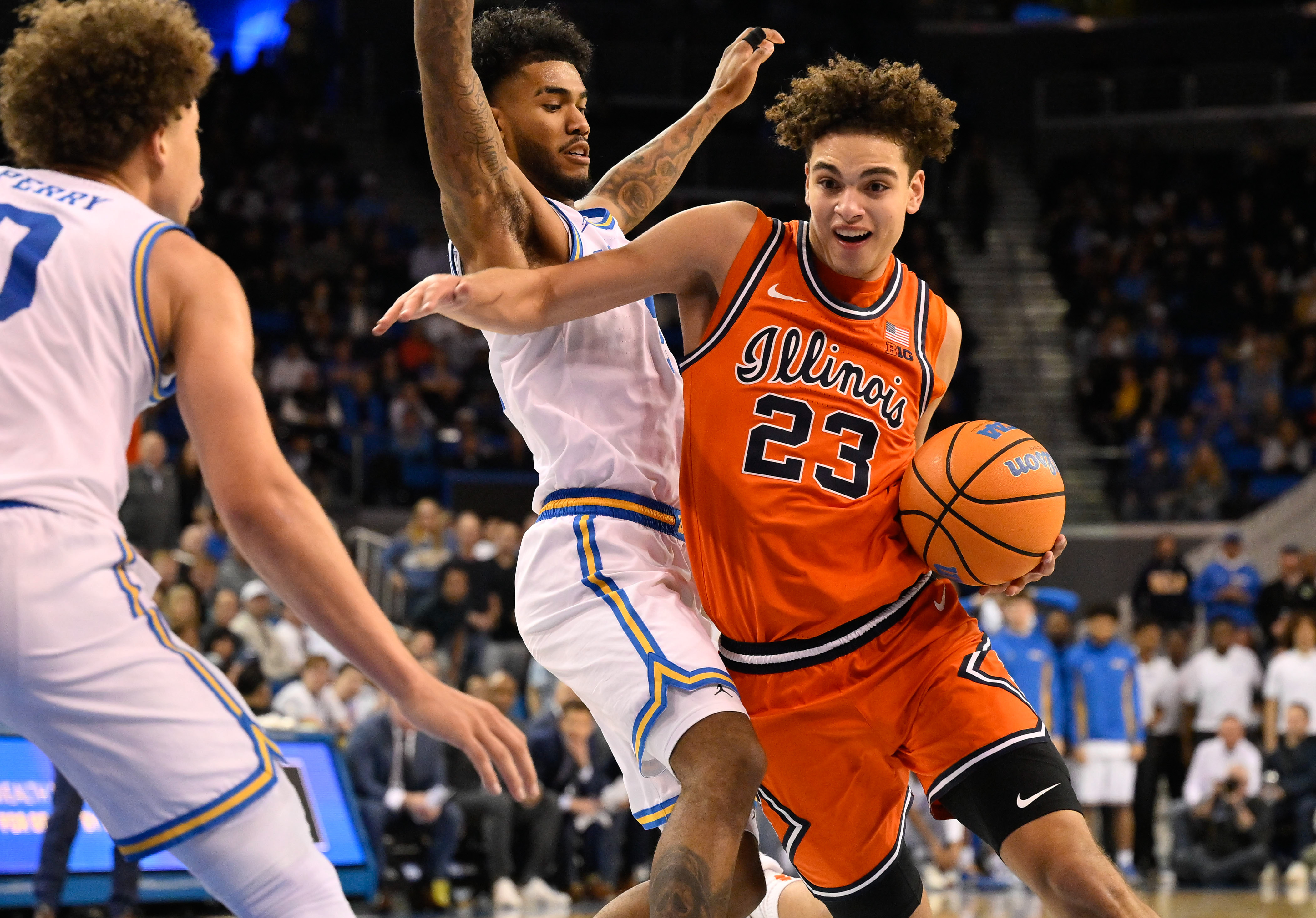 Illinois guard Keaton Wagler drives to the basket as we make our best Penn vs. Illinois prediction.