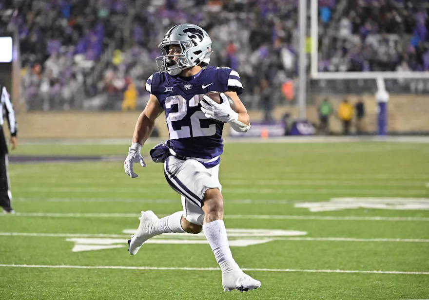 Running back Deuce Vaughn of the Kansas State Wildcats runs for a touchdown against the Kansas Jayhawks at Bill Snyder Family Football Stadium on Nov. 26, 2022 in Manhattan, Kansas.