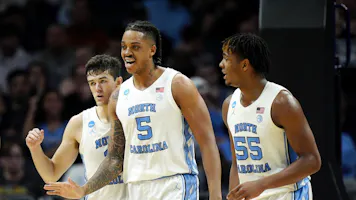 Cormac Ryan #3, Armando Bacot #5 and Harrison Ingram #55 of the North Carolina Tar Heels react as we make our Alabama vs. UNC expert picks and predictions for the Sweet 16 of the NCAA Tournament on Thursday.