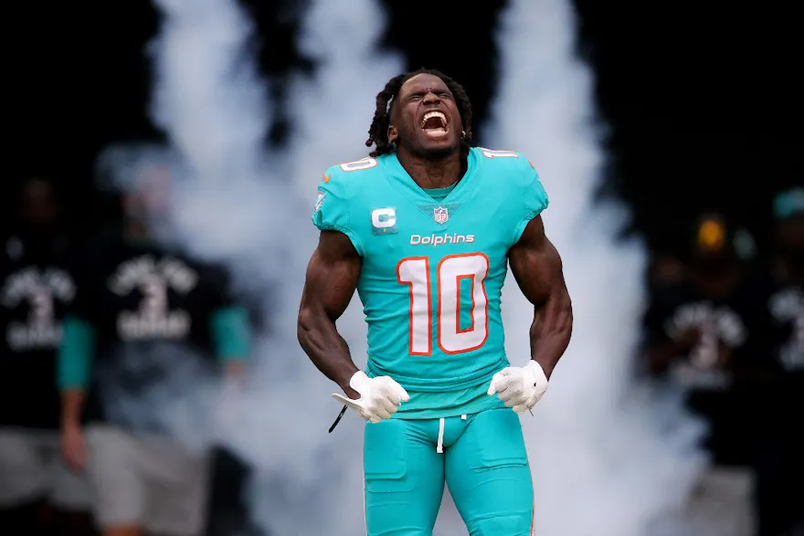 Tyreek Hill of the Miami Dolphins yells while running onto the field prior to a game against the New York Jets, and we offer new U.S. bettors our exclusive BetRivers bonus code.