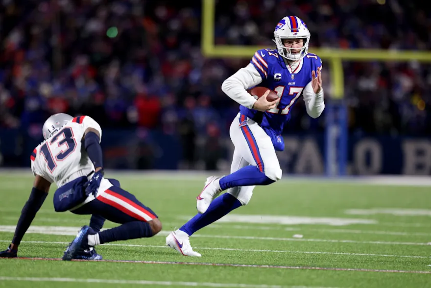 Josh Allen of the Buffalo Bills jukes a New England Patriots defender