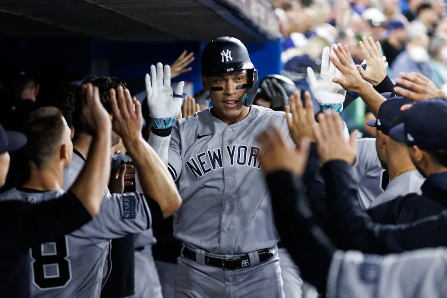 Aaron Judge of the New York Yankees celebrates a two-run homer as we look at our 2024 MLB home run leader odds.