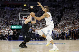 Luka Doncic of the Dallas Mavericks shoots a 3-pointer against Rudy Gobert of the Minnesota Timberwolves during Game 2 of the Western Conference Finals. We're backing Doncic in our Timberwolves vs. Mavericks Parlay. 