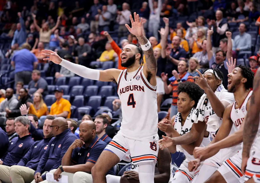 Johni Broome #4 of the Auburn Tigers celebrates as we look at our Florida vs. Auburn prediction for the SEC Tournament Championship.