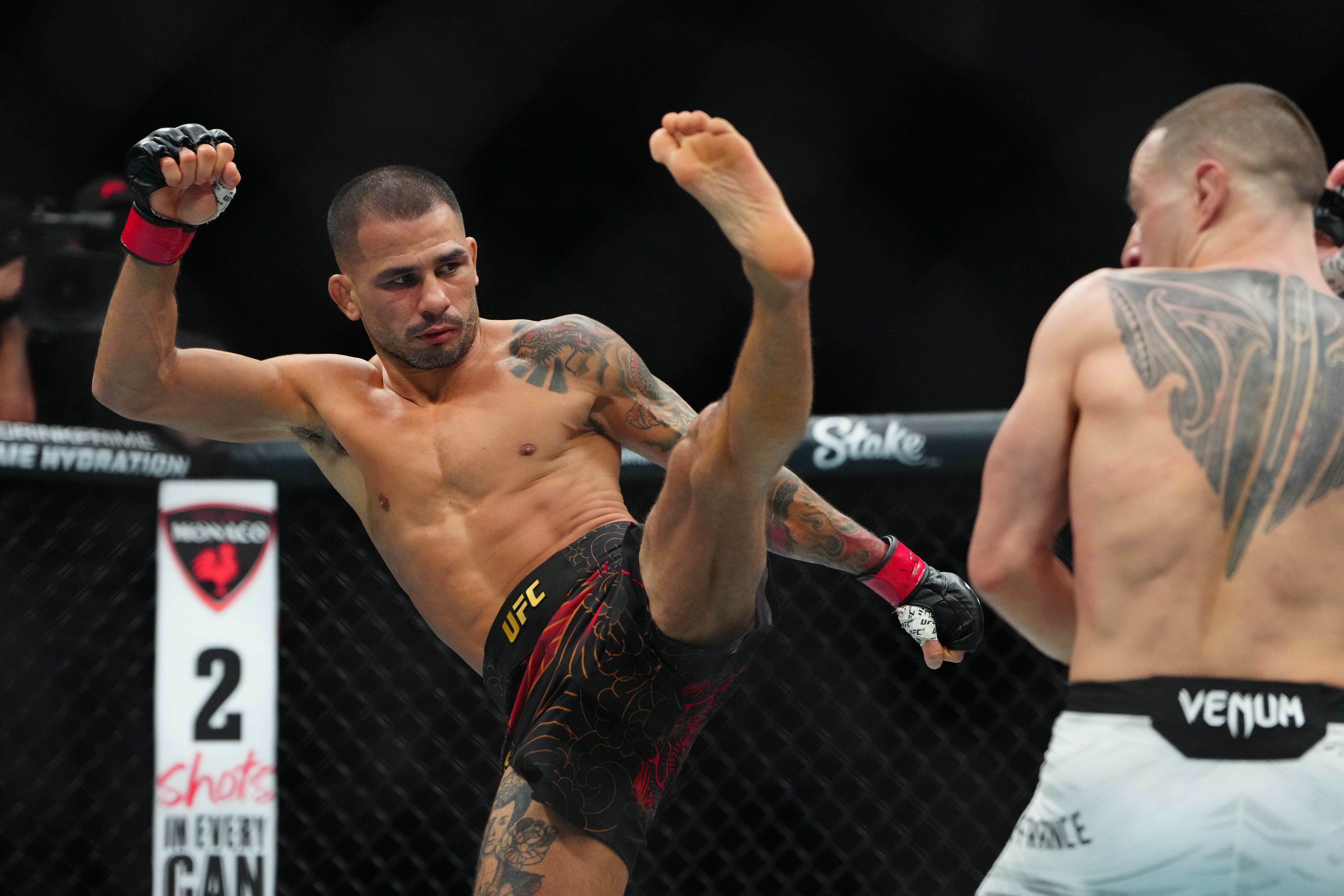 Alexandre Pantoja (left) kicks as we offer our Alexandre Pantoja vs. Joshua Van prediction