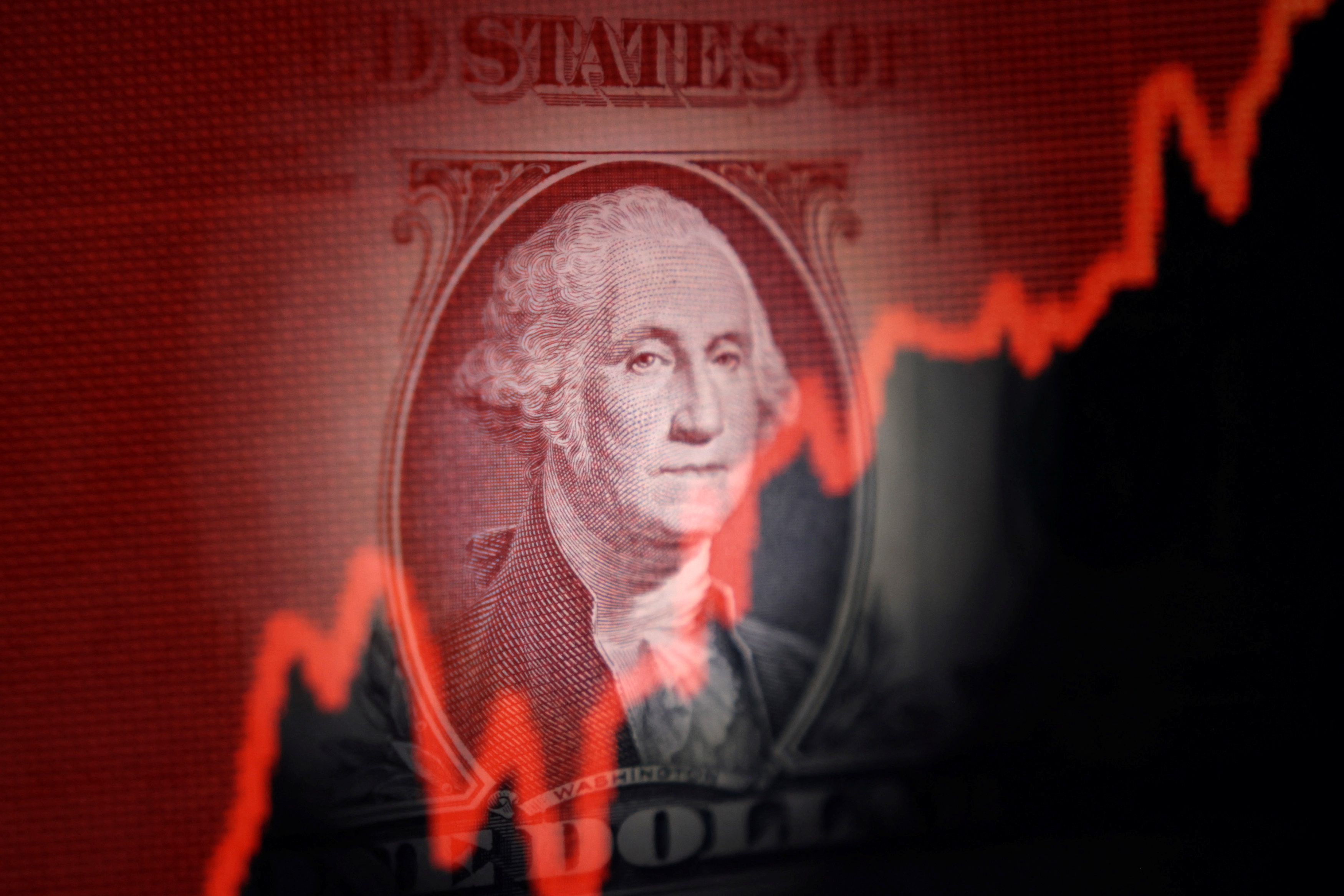 U.S. dollar banknote and rising stock graph are seen in this illustration as we look at the World Cup impact on DraftKings and FanDuel stocks