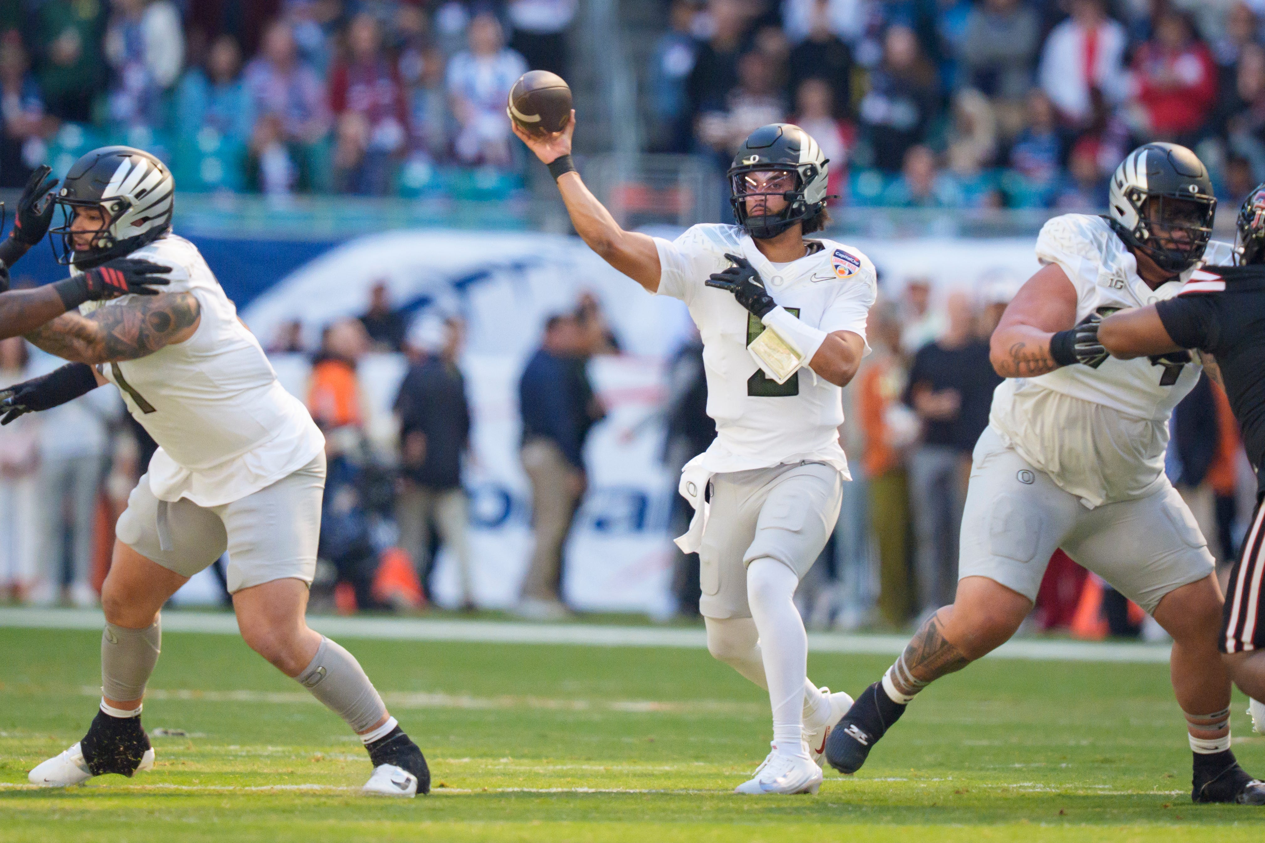 Oregon's Dante Moore leads the Ducks into the Peach Bowl, one of the final matchups highlighted in our college football bowl game odds and schedule.