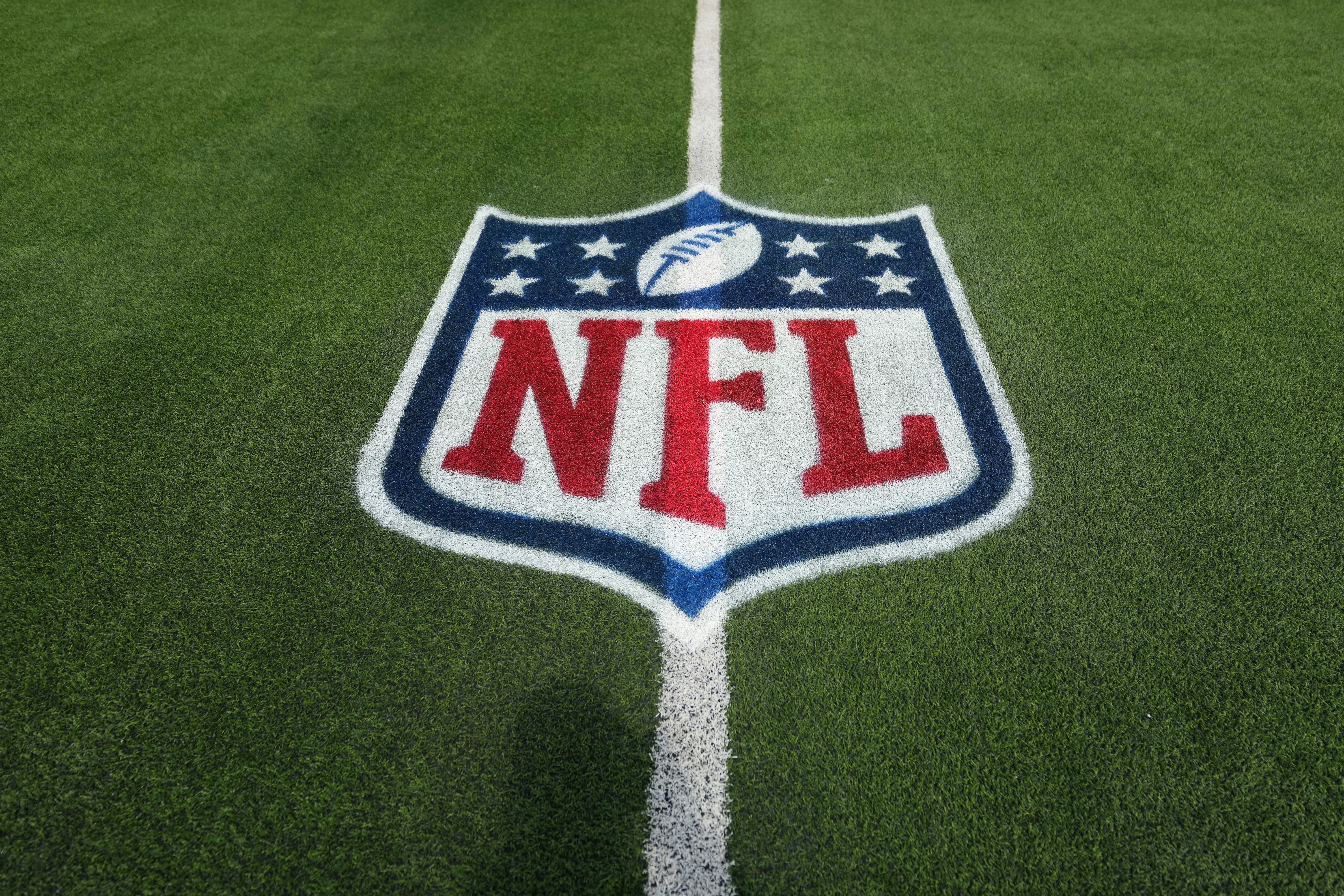 The NFL shield logo on a field as we look at the AGA's projections for sports betting handles in 2026.