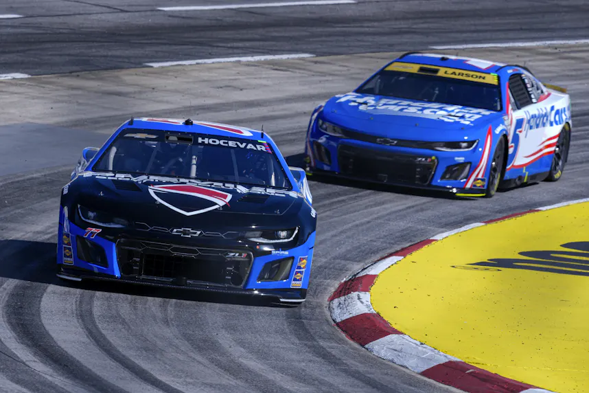 NASCAR Cup Series driver Carson Hocevar (77) followed by driver Kyle Larson (5) as we offer our Xfinity 500 predictions, expert picks, and long shots at Martinsville Speedway.