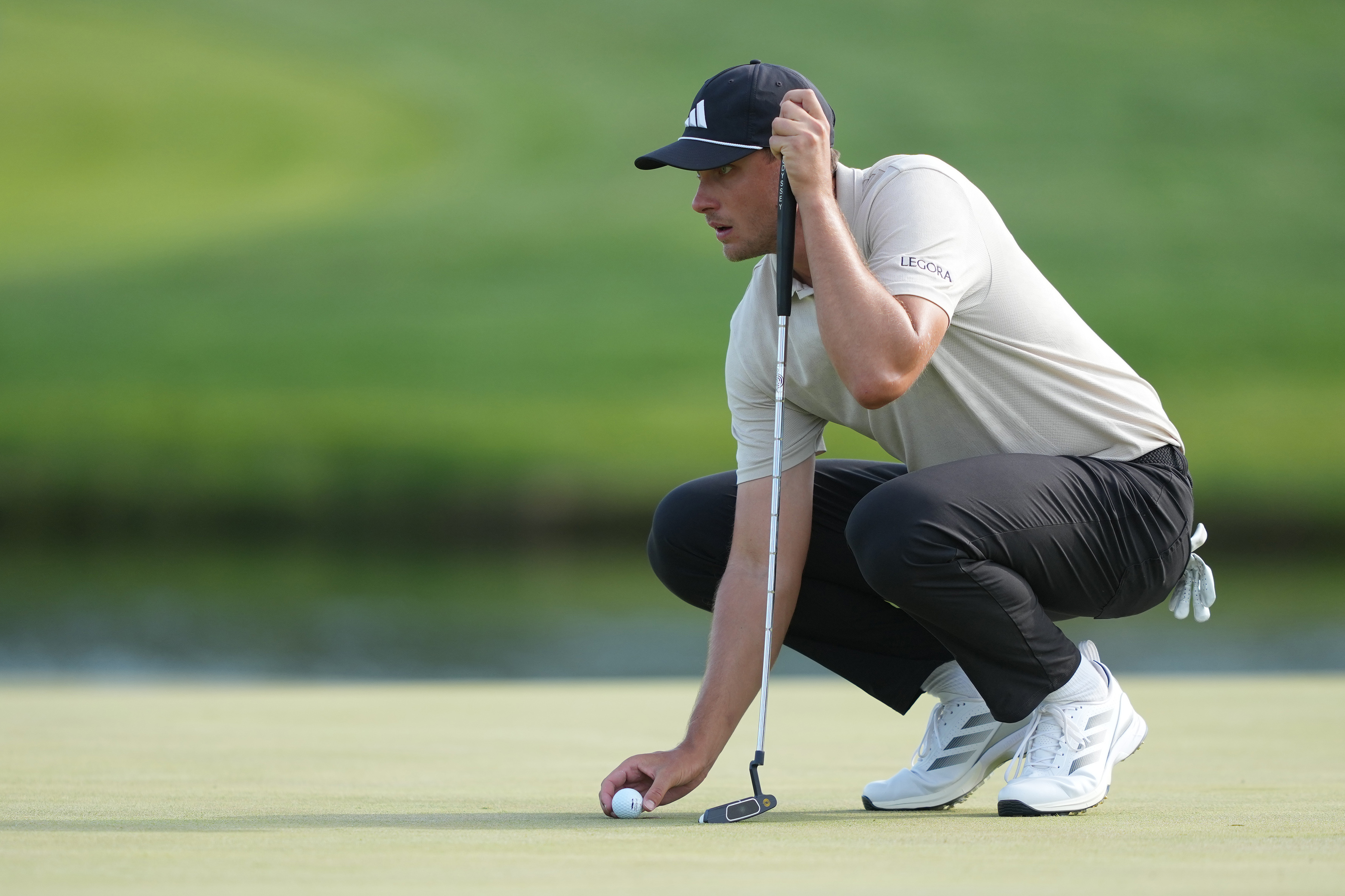 Ludvig Aberg prepares to putt on the 18th hole as we break down our Charles Schwab Challenge first-Round leader prediction & odds.