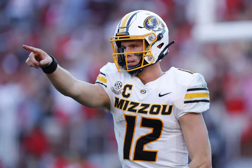 Brady Cook #12 of the Missouri Tigers reacts during the third quarter against the Georgia Bulldogs as we make our Missouri vs. Ohio State prediction and pick for the 2023 Cotton Bowl on Friday.