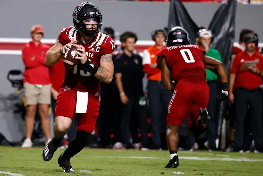 Devin Leary #13 of the North Carolina State Wolfpack looks to pass during the first half of their game against the Connecticut Huskies at Carter-Finley Stadium on Sept. 24.