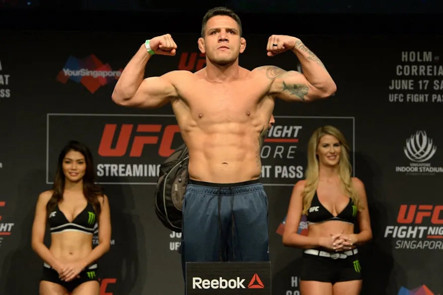 Rafael dos Anjos of Brazil stands on a weighing scale during the UFC Fight Night official weigh-in in Singapore as we look at the UFC Fight Night Caesars promo.