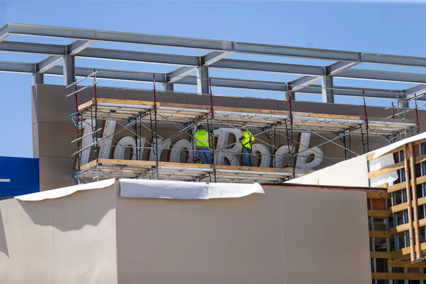 Construction workers build the Hard Rock Casino sign as we look at a new date for licensing casinos in downstate New York.