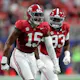 Dallas Turner #15 of the Alabama Crimson Tide reacts as we look ahead to the 2024 NFL Defensive Player of the Year odds ahead of the 2024 NFL Draft.