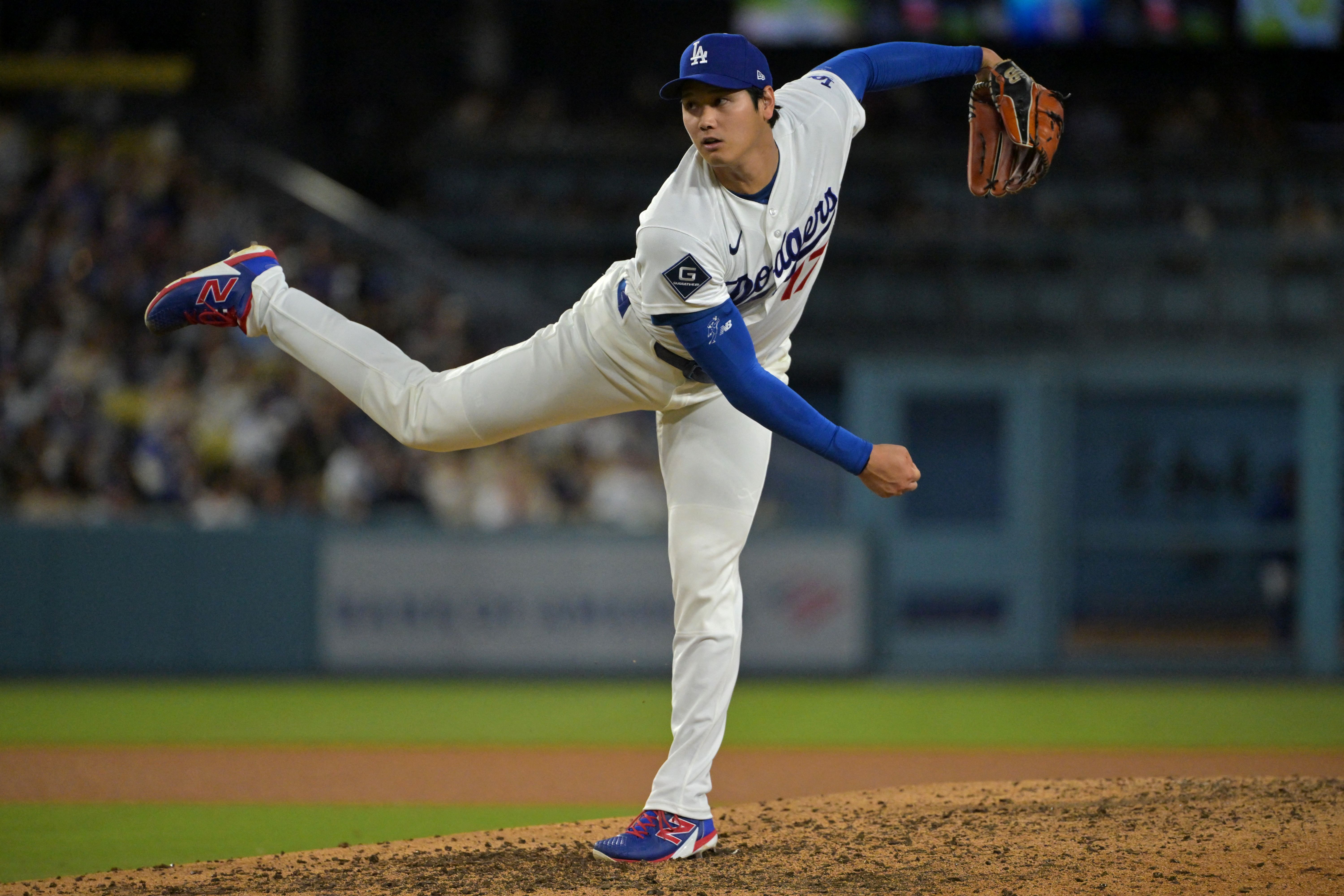 Los Angeles Dodgers starting pitcher Shohei Ohtani delivers to the plate, and he's featured as we look at our Dodgers vs. Astros prediction.