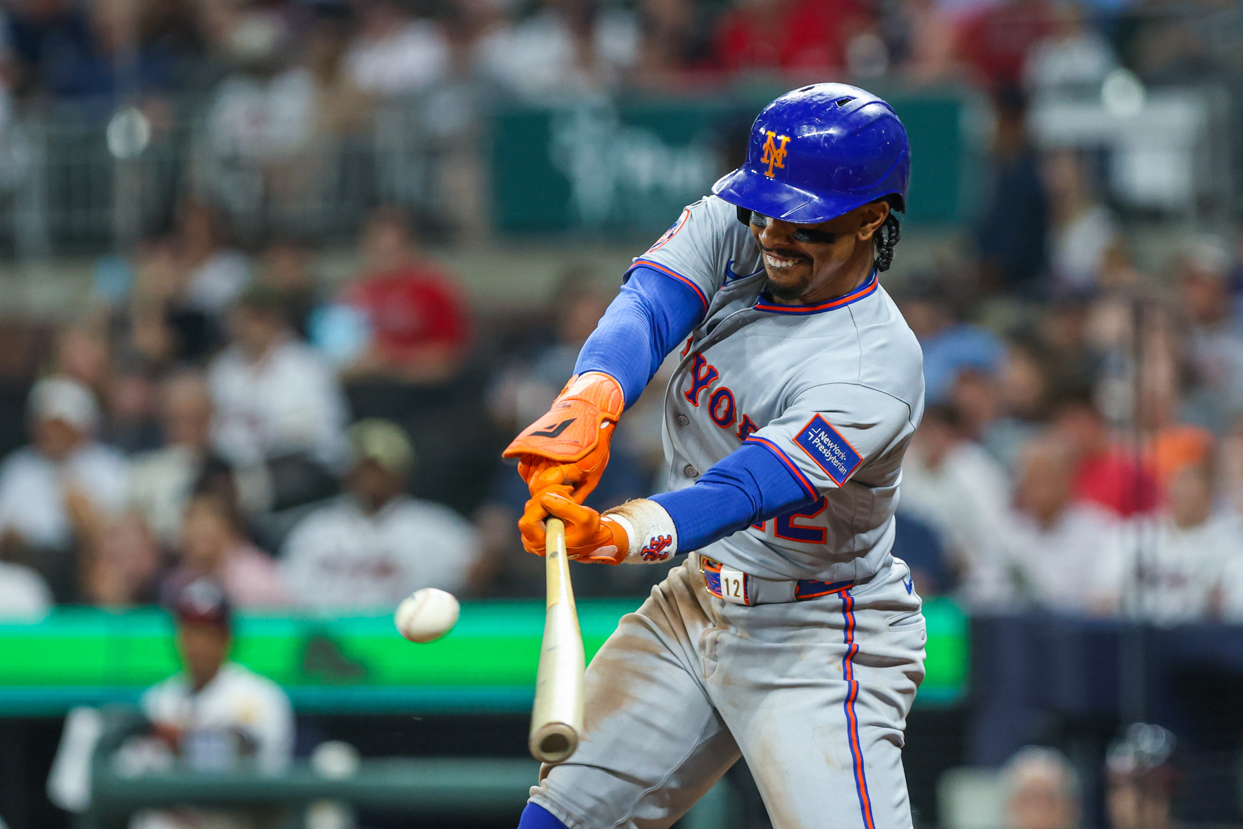 New York Mets shortstop Francisco Lindor (12) hits as he is featured in our Mets vs. Braves prediction.